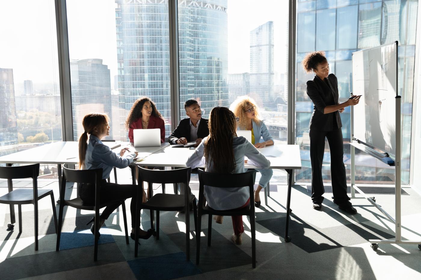 People working around a boardroom table.